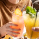 Staying Sober in New Jersey: Tips for Social Events 93 How to Stay Sober at a Party in New Jersey featured images with a person holding a nonalcoholic drink