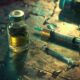 a GHB bottle and medical syringe on the table