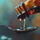 codeine cough syrup poured into spoon
