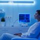 patient in a biofeedback session with sensors and digital monitor in a calm, modern therapy room