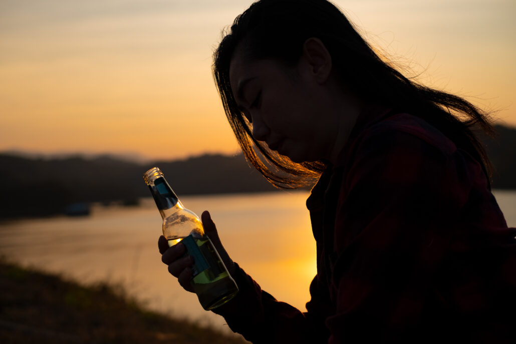 asian silhouette woman holding beer bottle on the 2025 02 10 00 31 36 utc